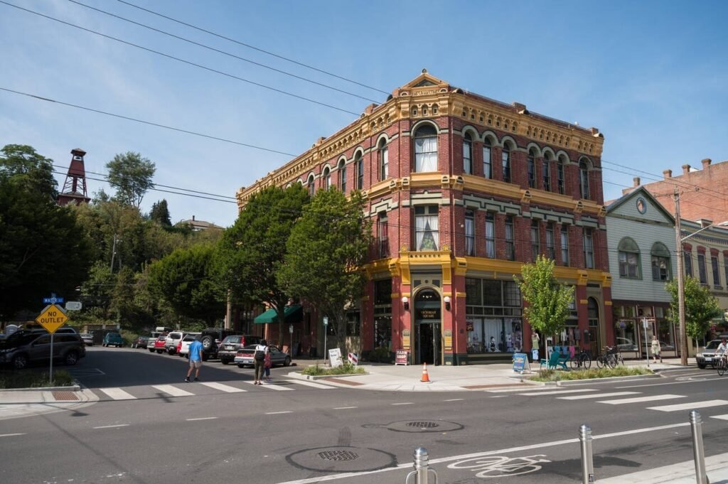 A prominent red-brick Victorian-era building on a street corner in the historic downtown of Port Townsend, Washington.