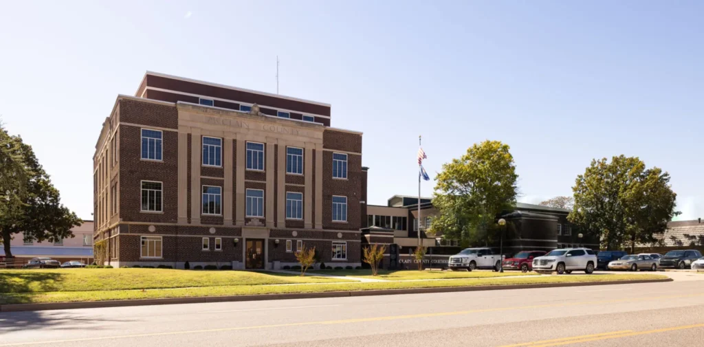 The McClain County Courthouse building in Purcell, Oklahoma, on a sunny day, viewed from across the street.