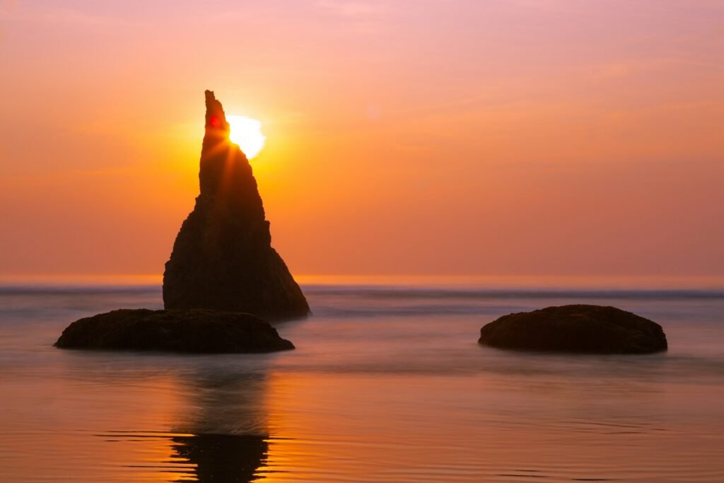 Face Rock and other unique sea stacks along Bandon, Oregon’s dramatic coastline at sunset.